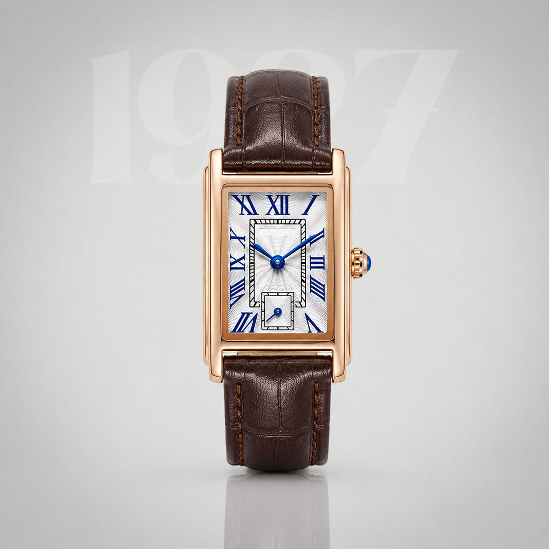 1927 gold Art Deco tank watch, silver guilloche dial with blue Roman numerals on brown crocodile strap
