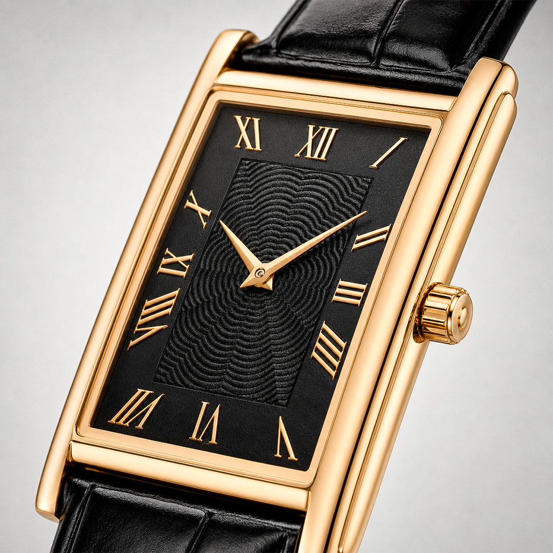 Close-up of the 1962 gold tank watch, black guilloche dial and gold Roman numerals