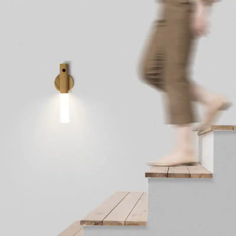 Rechargeable sensor wall light — motion-activated as a person walks up a staircase