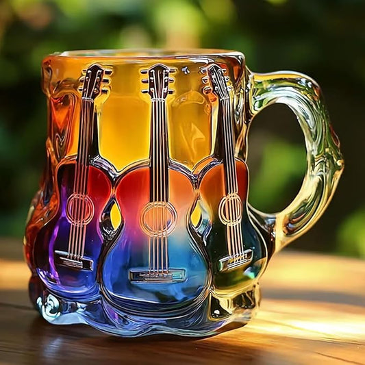 Colorful glass mug with guitar design on a wooden surface