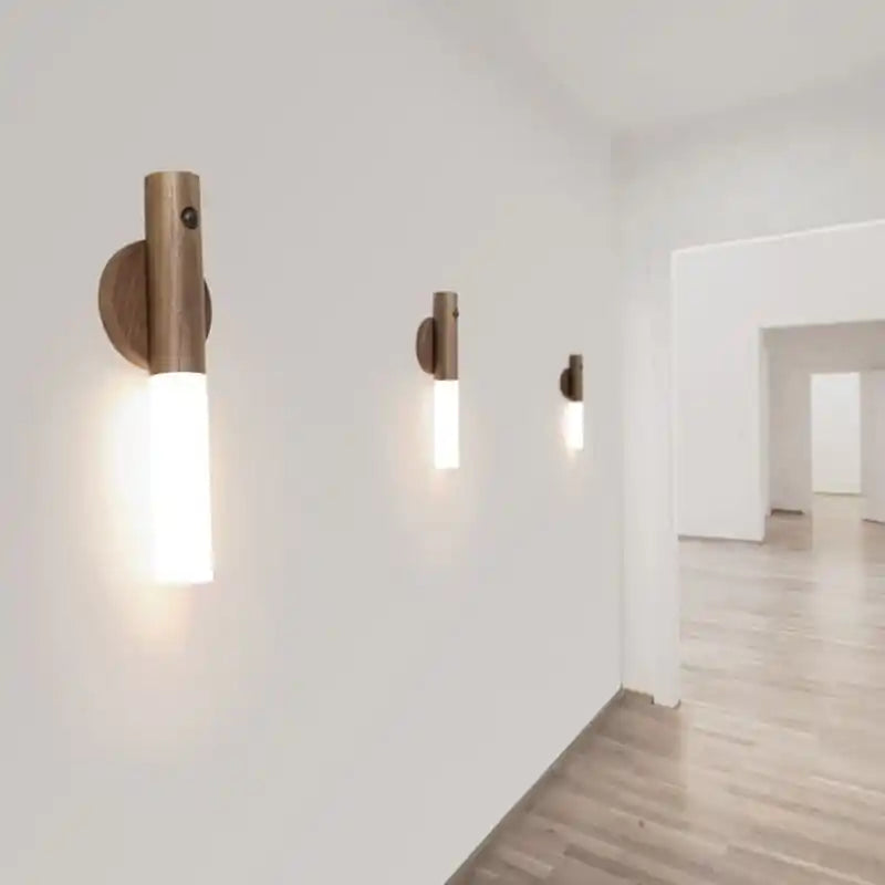 Rechargeable sensor wall light — three spaced along a bright hallway