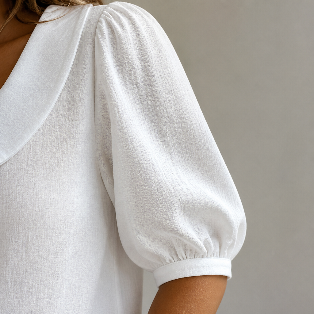 LuminaLuxe™ – Soft Peter Pan Collar Half-Sleeve Blouse
